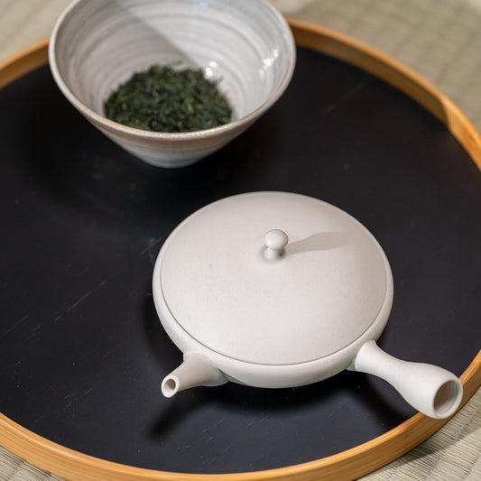 A Tokoname yaki teapot and Japanese tea on a tray