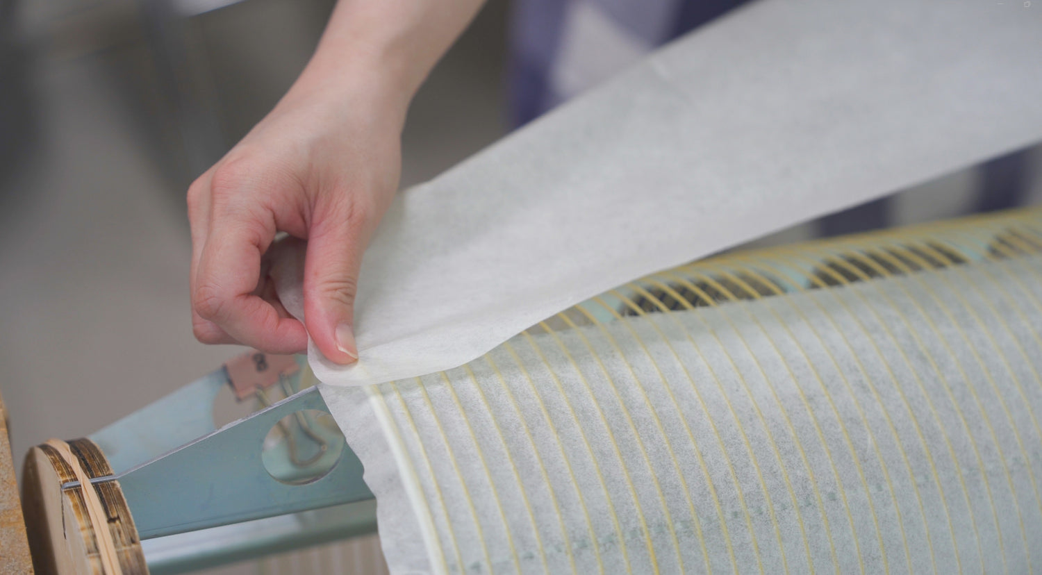 A close up of a washi paper lamp being made by Asano Shoten craftsmen in Gifu, Japan