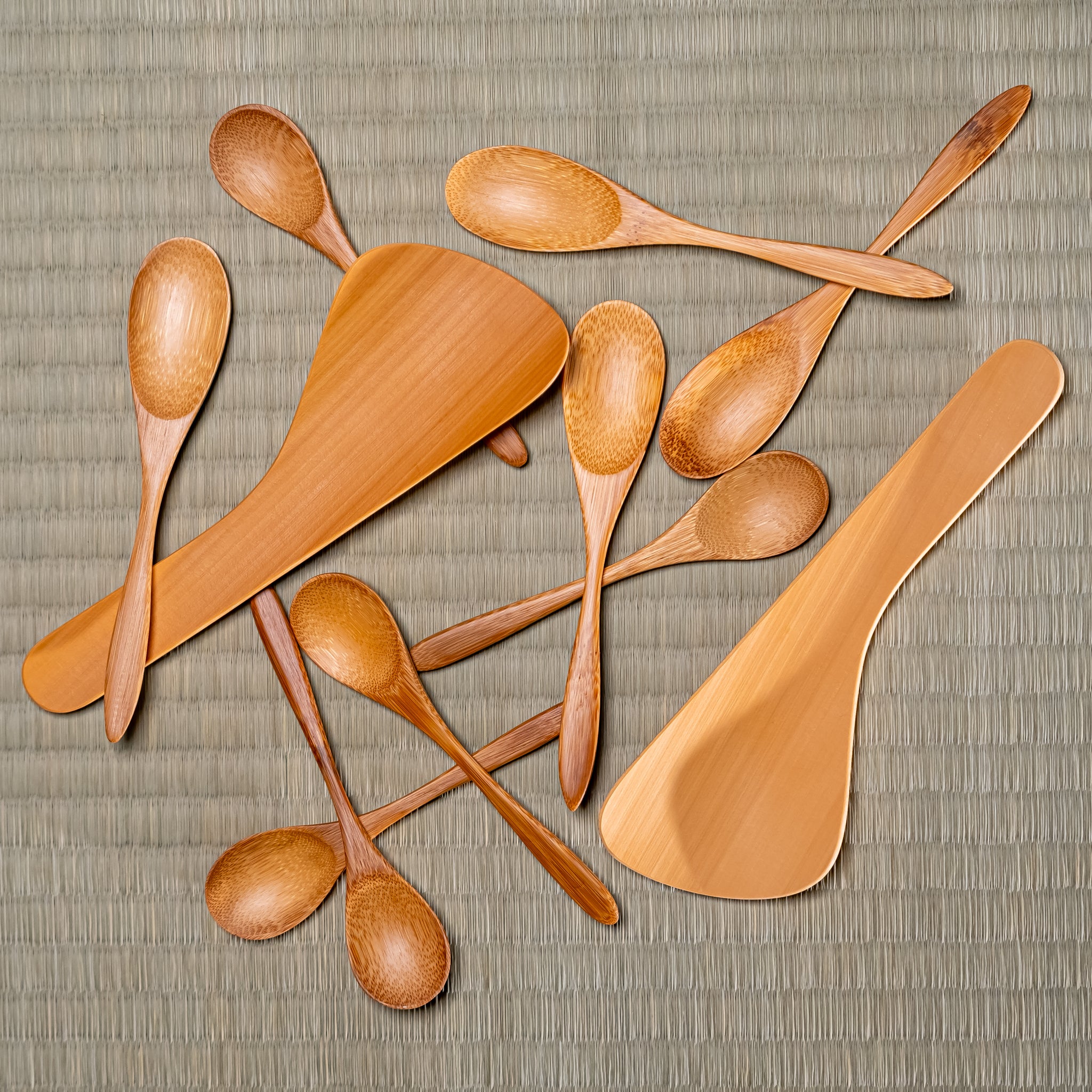A pile of Japanese bamboo spoons and rice servers