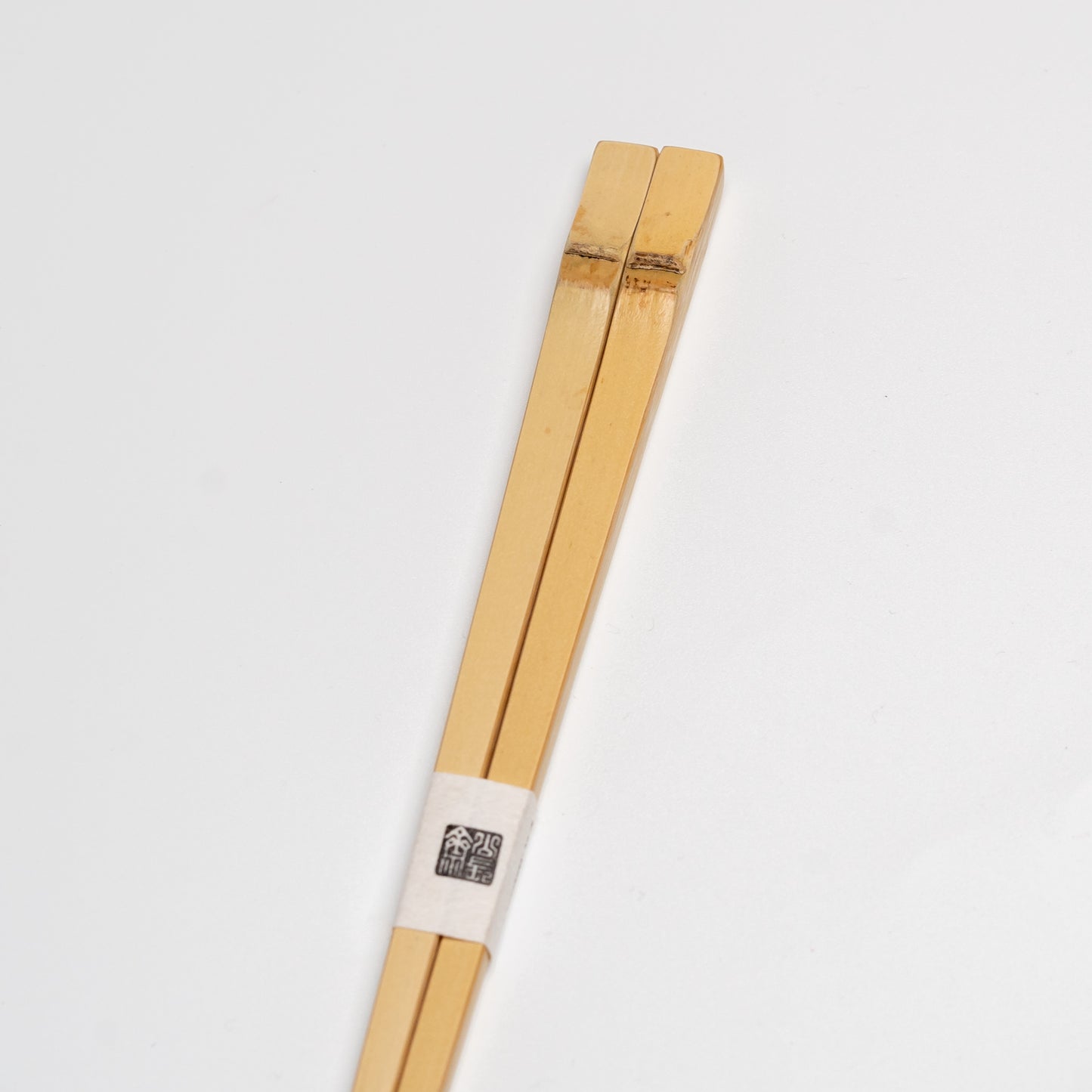 Japanese bamboo chopsticks on white background