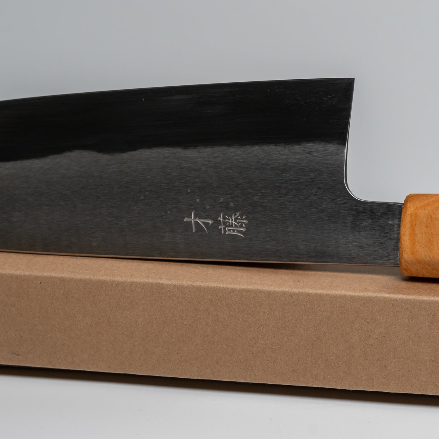 Close up of a Japanese Gyuto knife on its box