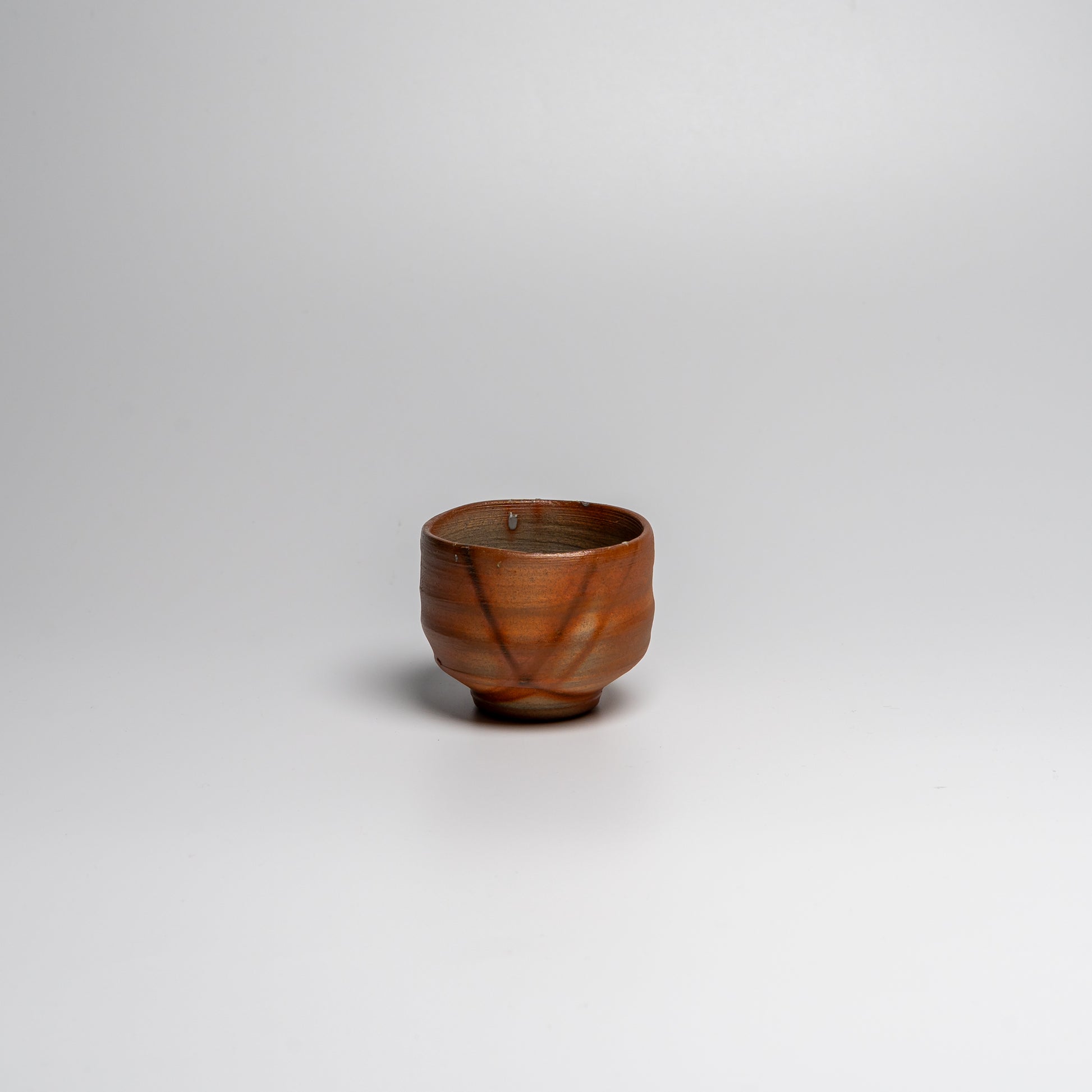 Japanese ceramic sake cup on white