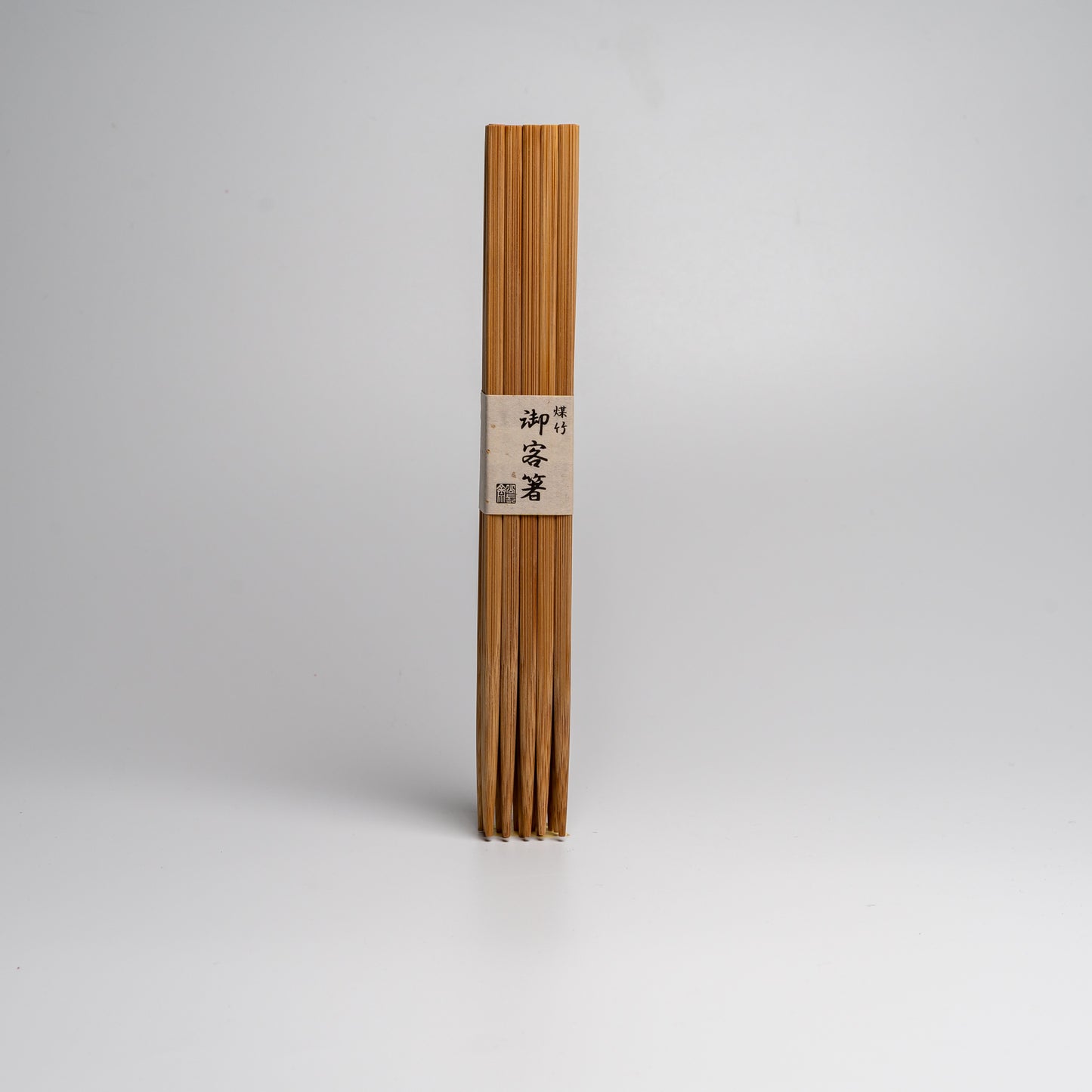 A large pack of Japanese bamboo chopsticks on white