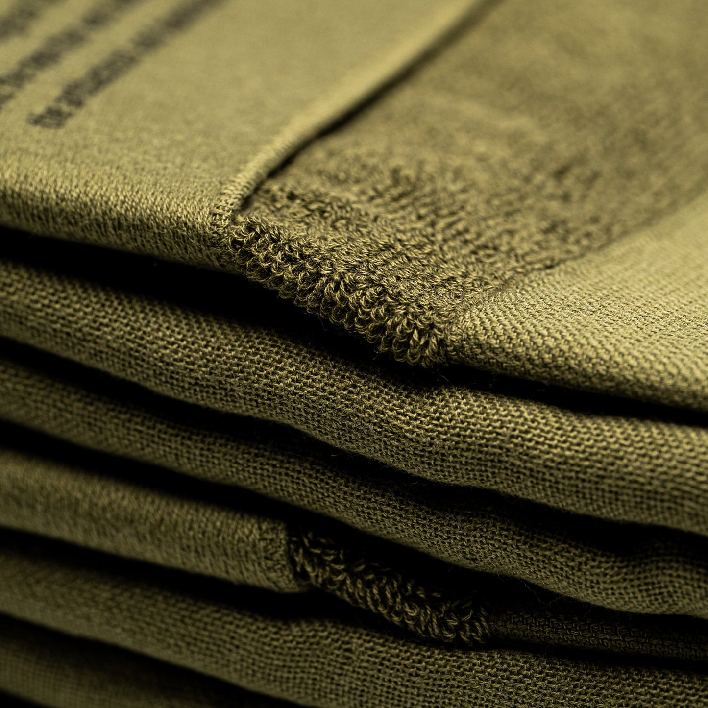 A stack of green Filhiba bath towels