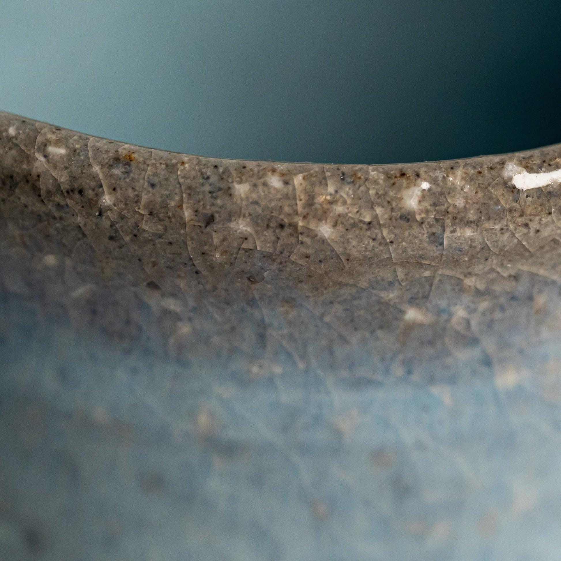 A close up of a blue Hagi yaki teacup 