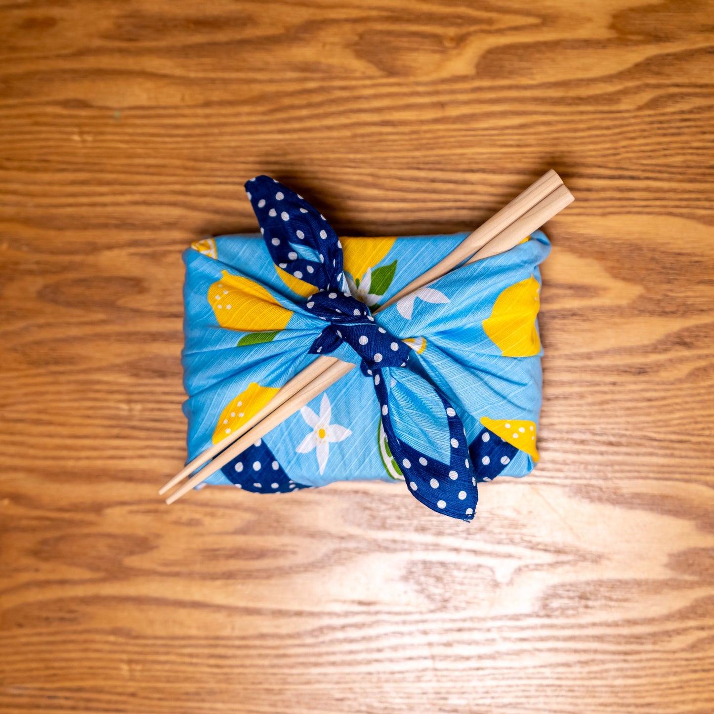 A Japanese bamboo bento box wrapped in furoshiki