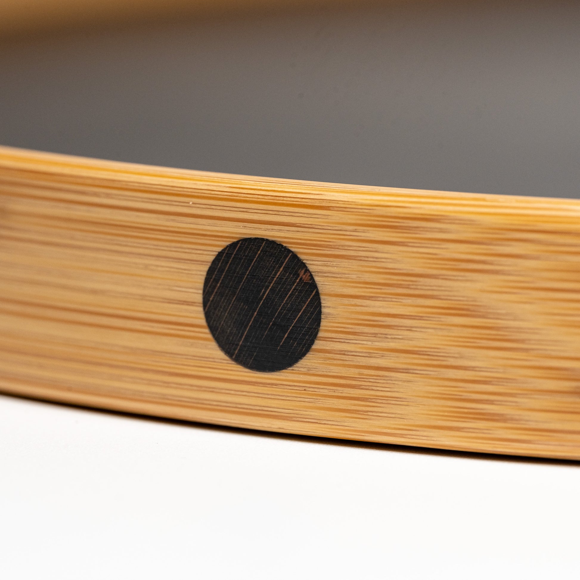 A close up of a Copenhagen series bamboo tray on a white background