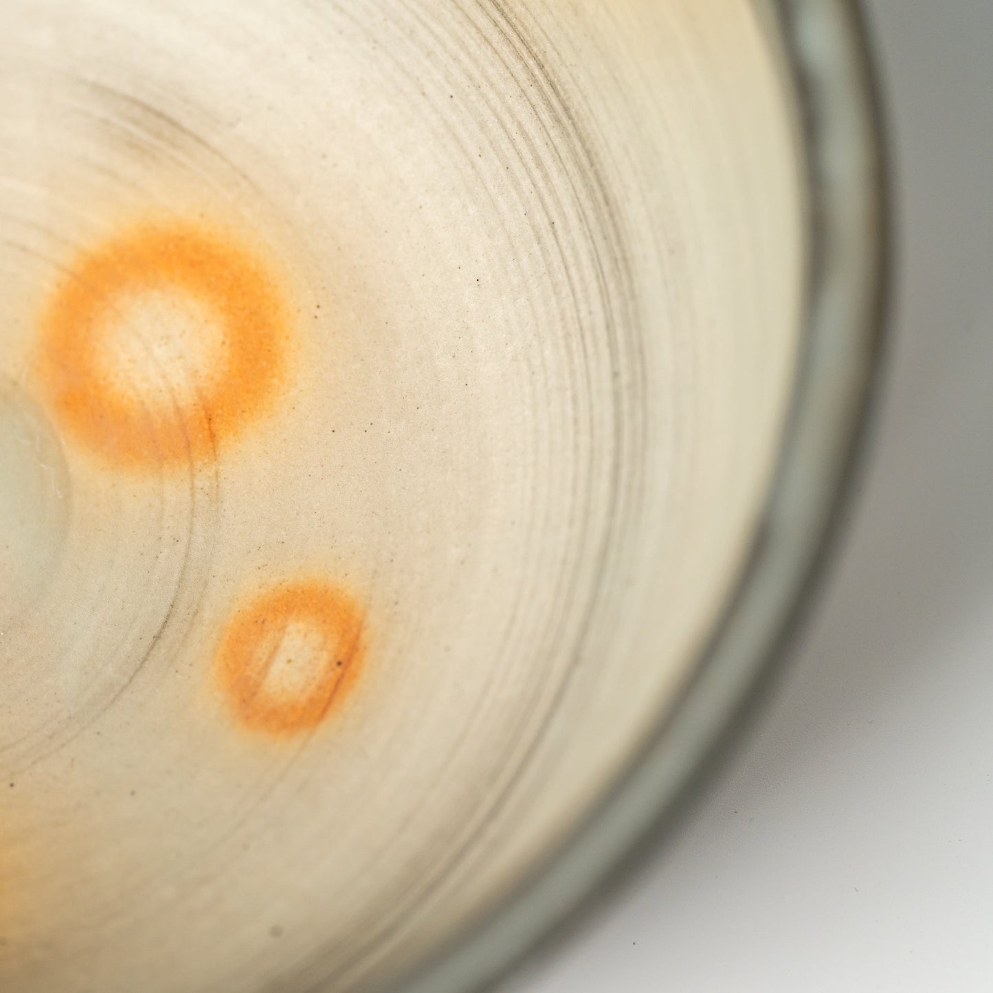 A close up of a Hagi yaki ramen bowl on a white background