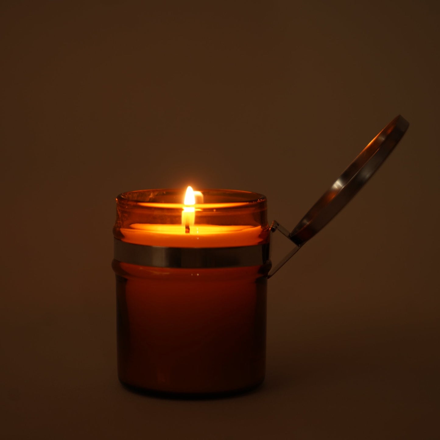 A lit hiba wood candle