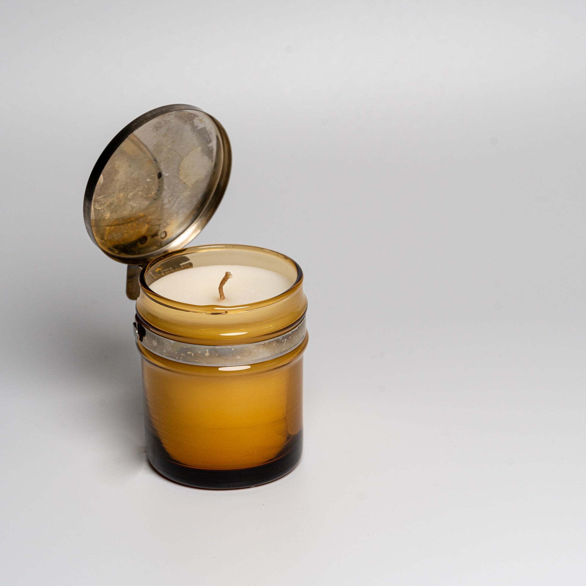 A Cul de Sac hiba wood candle in a glass jar on a white background