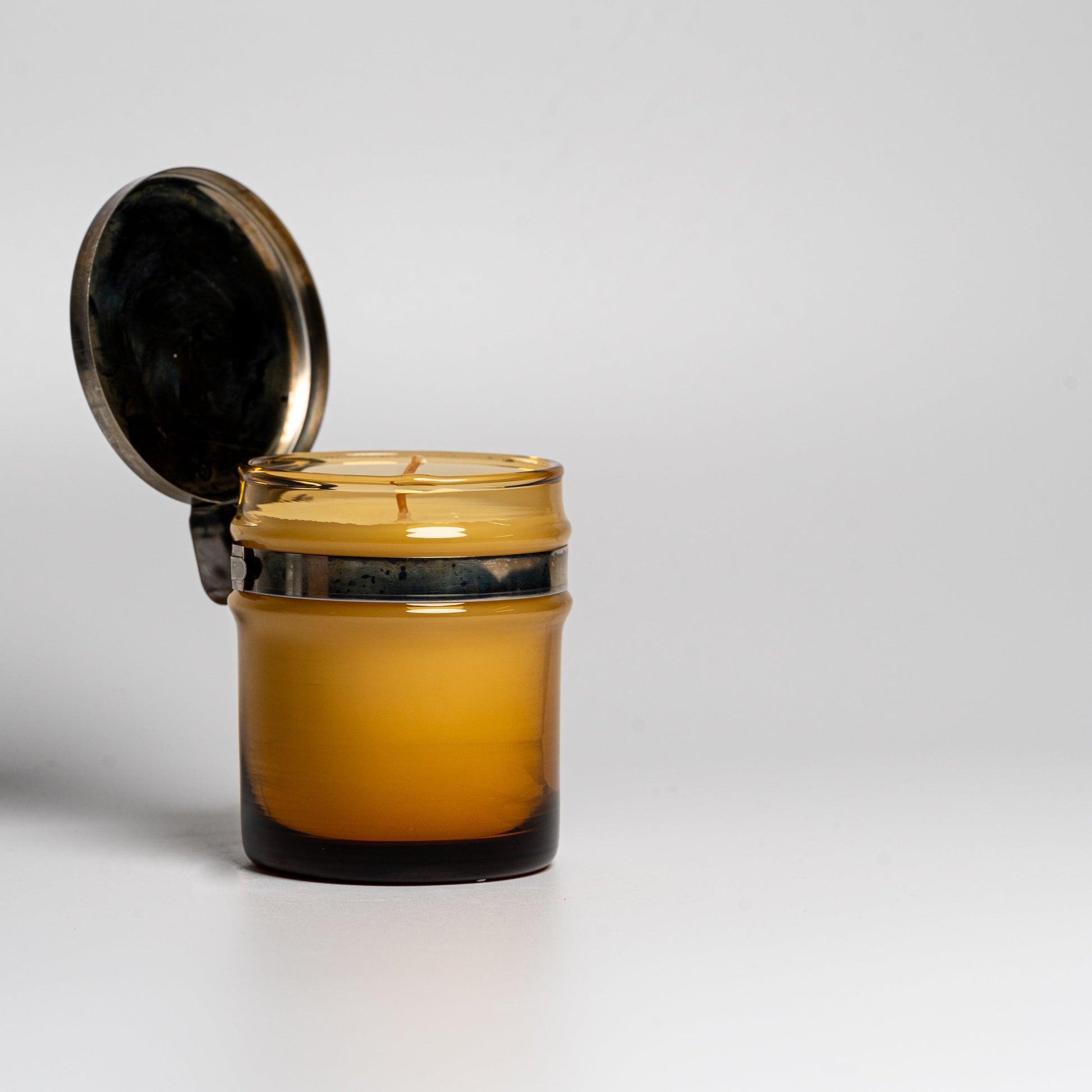 A Cul de Sac hiba wood candle in a glass jar on a white background