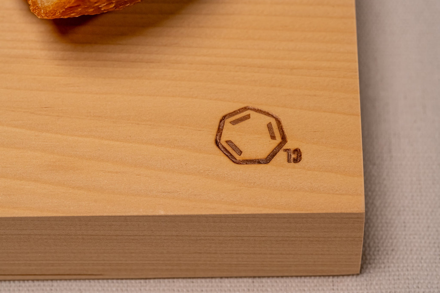 A close up of Cul de Sac's hiba wood chopping board