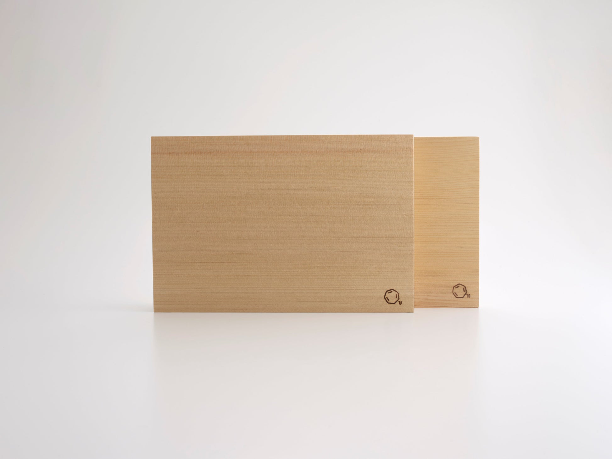 Two Cul de Sac hiba chopping blocks on a white background