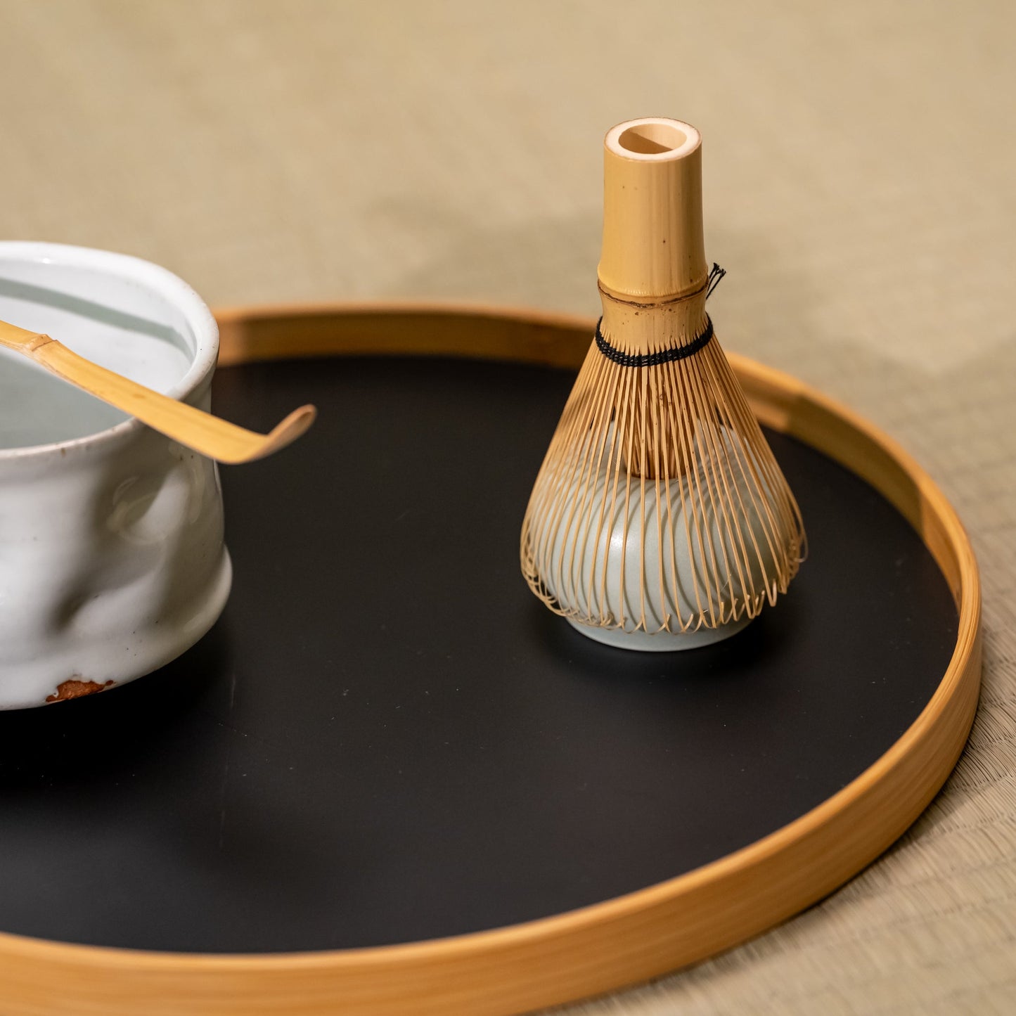 A Japanese tea set on a bamboo tray
