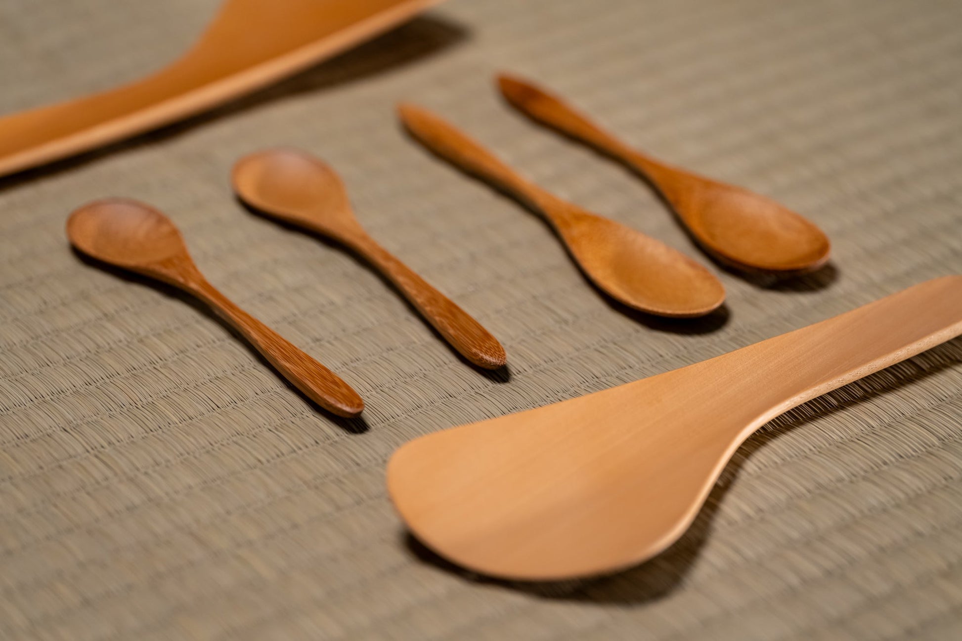 Japanese bamboo spoons and rice servers on a tatami mat