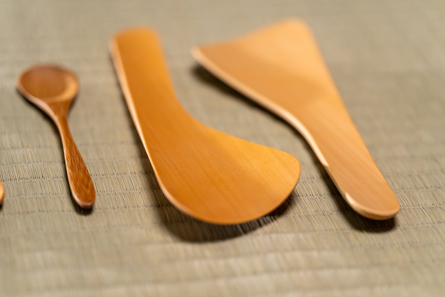 Japanese bamboo spoons and rice servers on a tatami mat