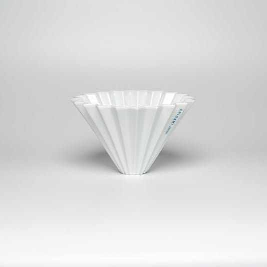A white ORIGAMI coffee dripper on a white background