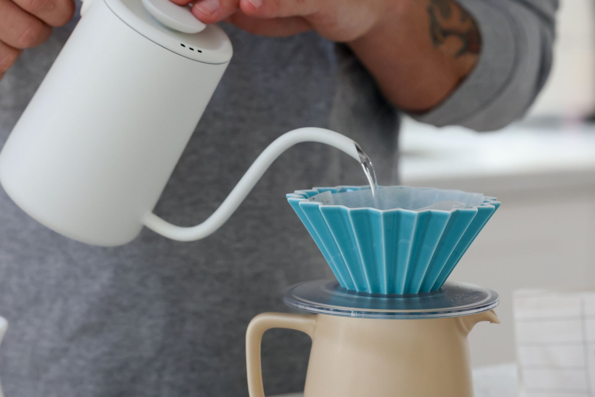 Bright blue ORIGAMI coffee dripper in use at home