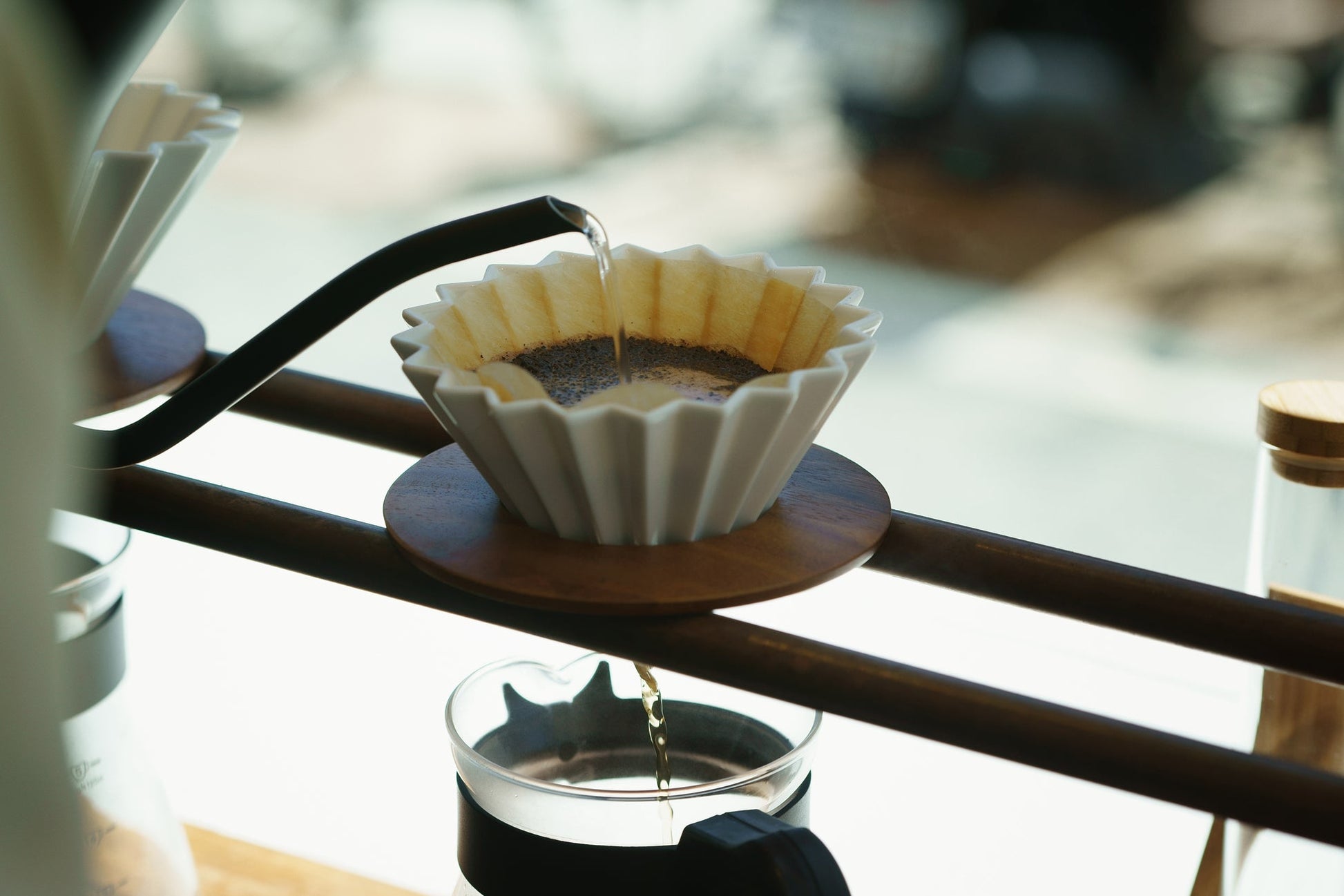 White ORIGAMI coffee dripper in use at a cafe in Japan