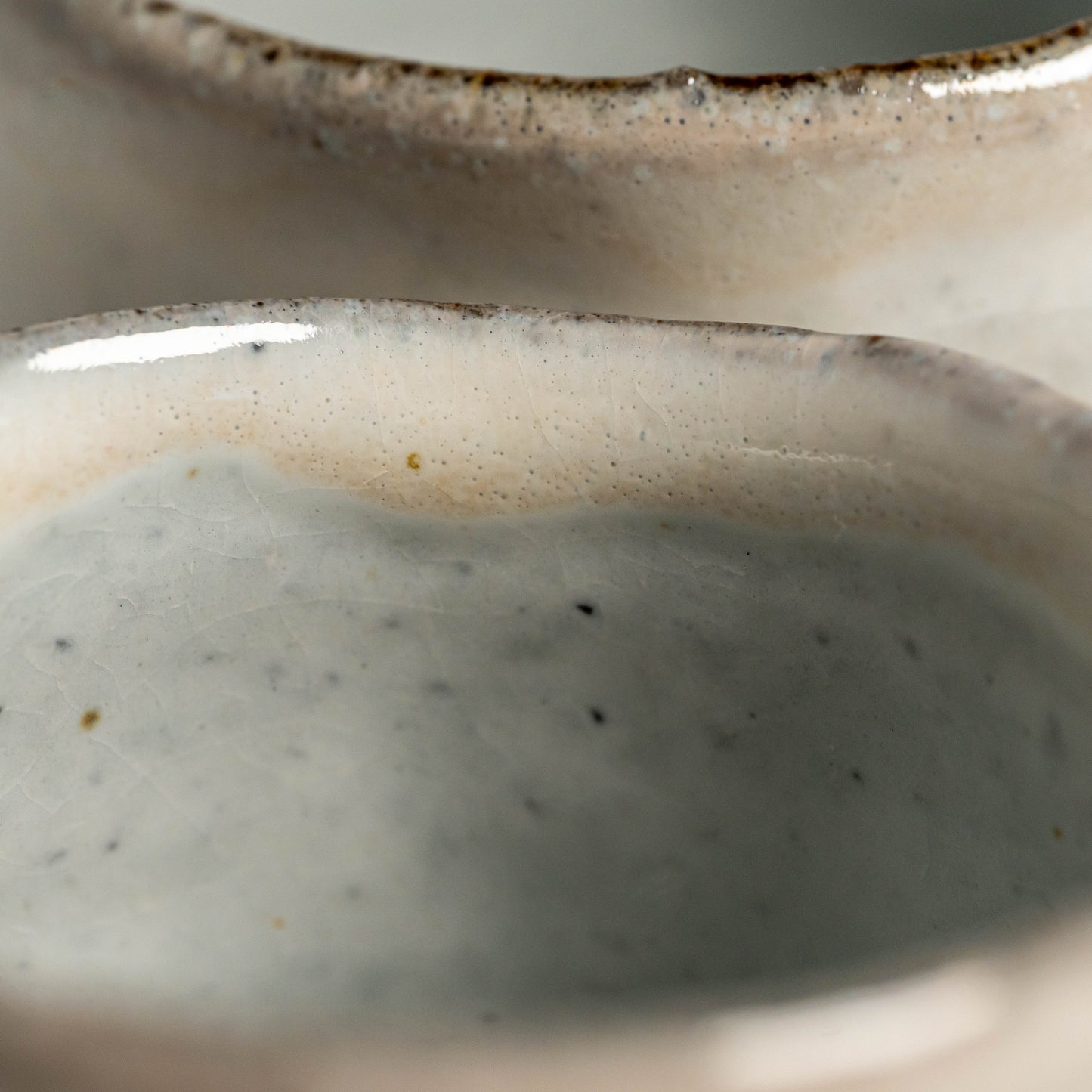 A close up of white Hagi yaki teacups 