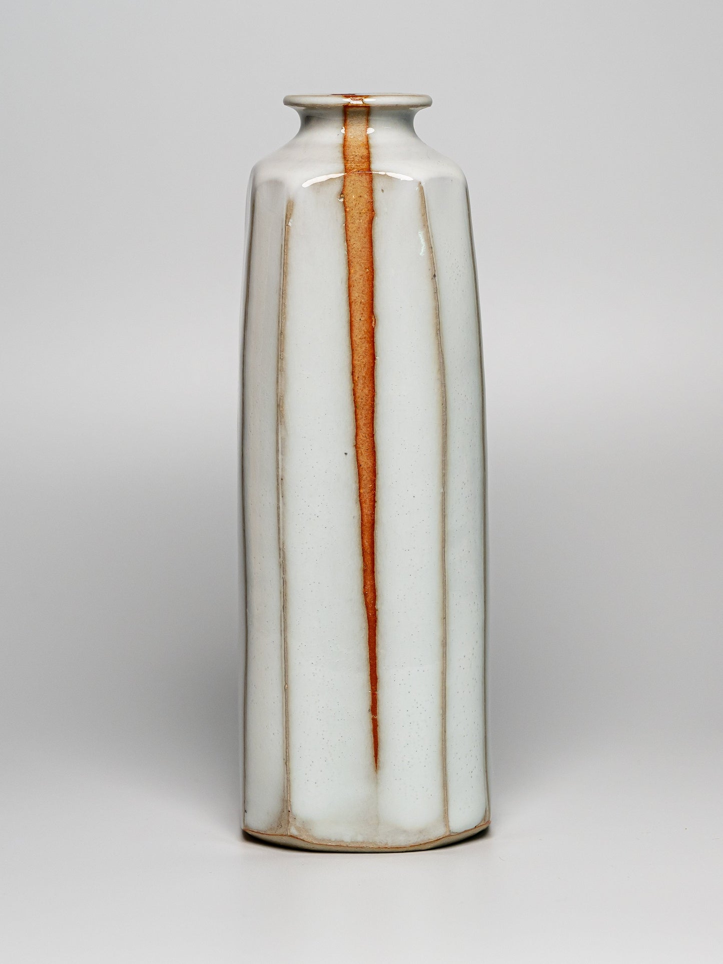 A white Hagi yaki vase on a white background