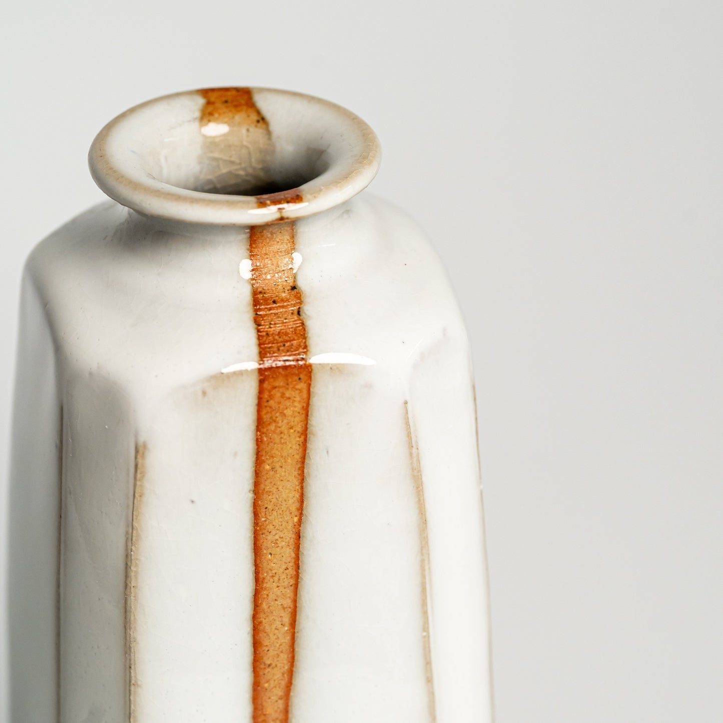 A close up of a white Hagi yaki vase