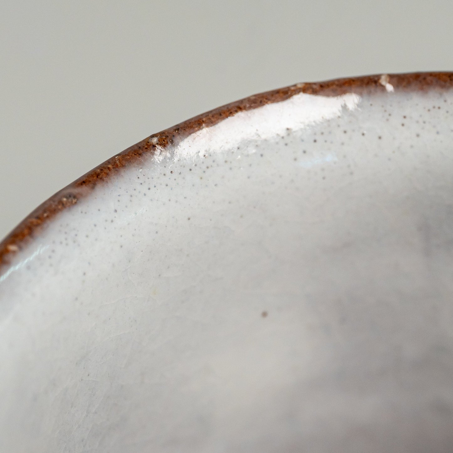 A close up of a white Hagi yaki shochu cup