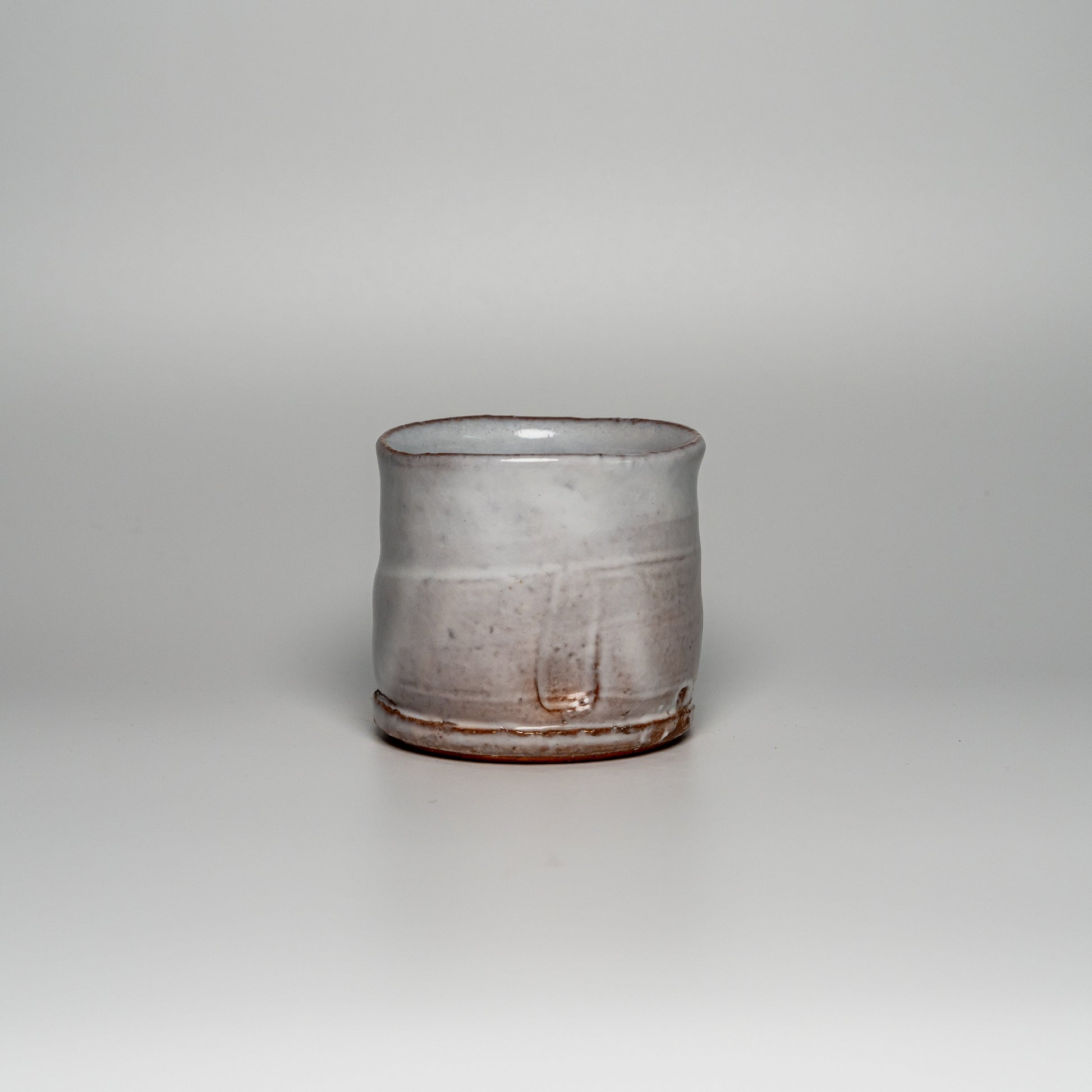 A white Hagi yaki shochu cup on a white background