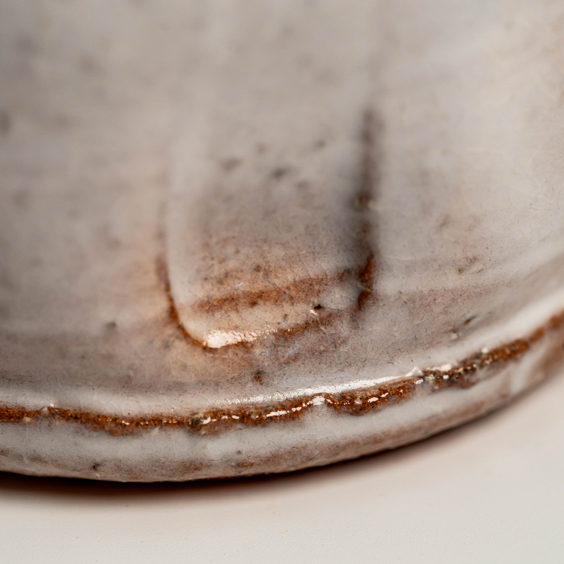 A close up of a white Hagi  yaki shochu cup