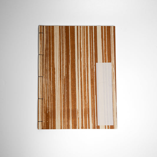 An Striped Kakishibuzome Awagami Factory washi paper Watoji Notebook on a white background